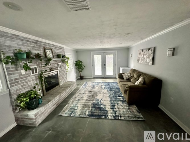 A living room with a fireplace and a couch.