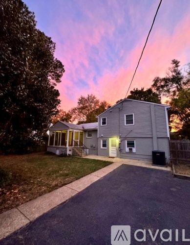 A house with a driveway in front of it.