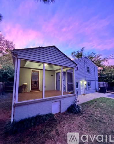A house with a porch and a covered patio is available for rent.