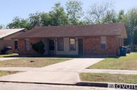 A brick house with a white door and windows.