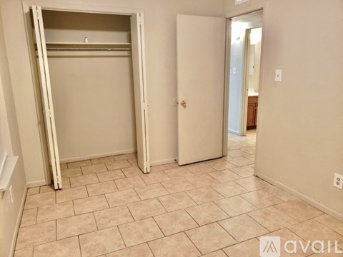 A room with a door and a wardrobe.