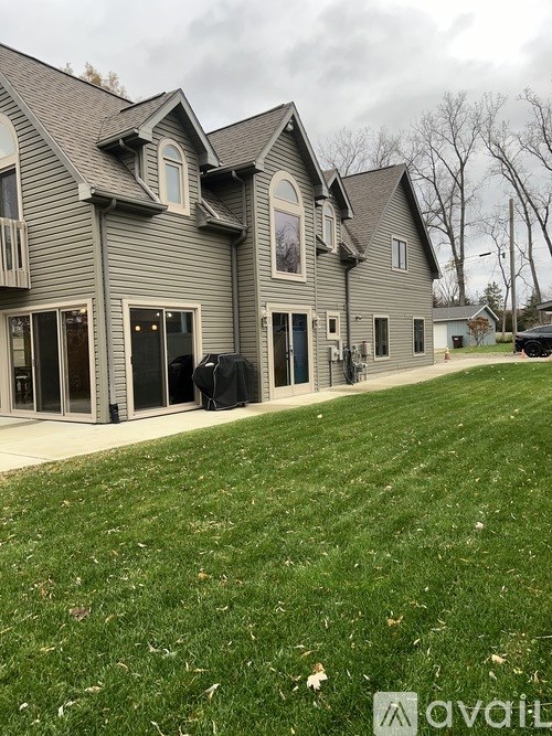 A house with a lawn in front of it.