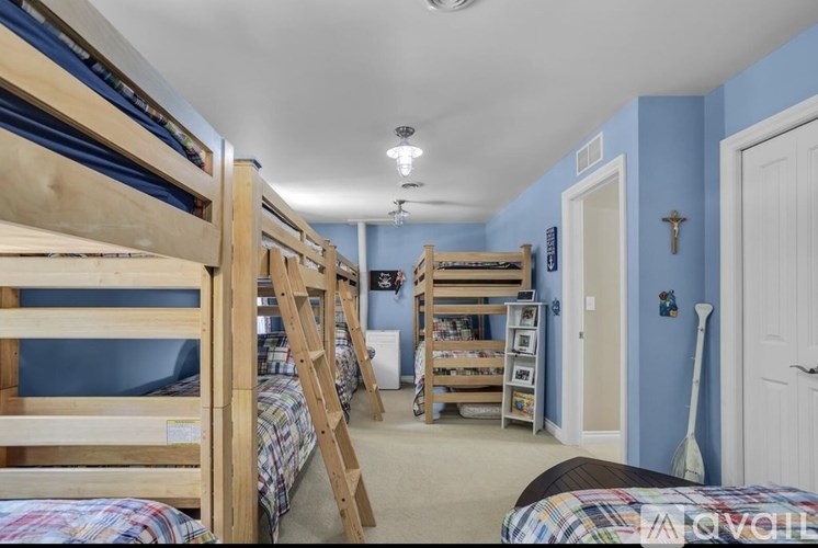 A room with bunk beds and a ladder.