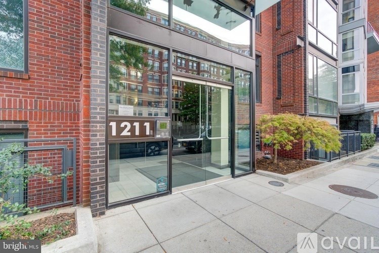 The image shows a building with the number 1211 on it.