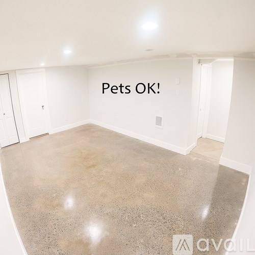 A room with a sign that says "Pets OK!" on the wall.