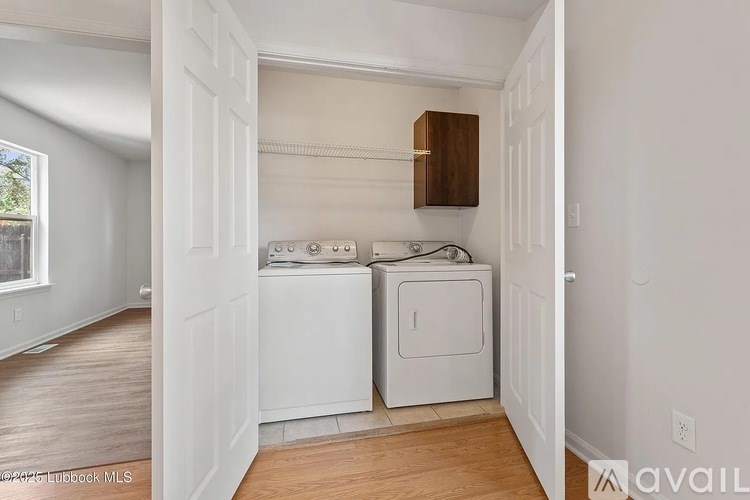 A laundry room with a washer and dryer.