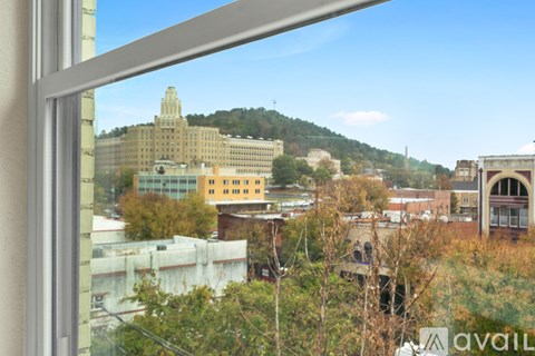 A view of a cityscape through a window.