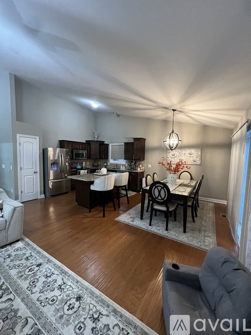 A well-lit dining area with a table set for six.