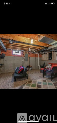 A room with a wooden ceiling and a carpeted floor.