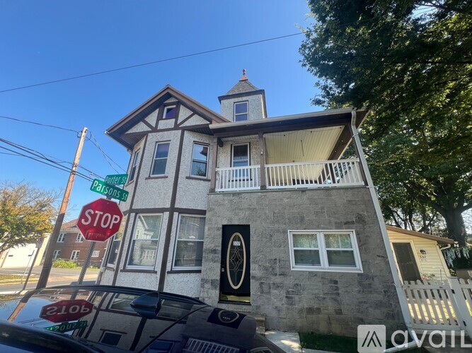 A house with a stop sign in front of it.