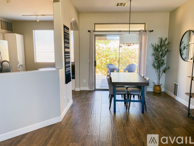 A dining room with a table and chairs is available for rent.