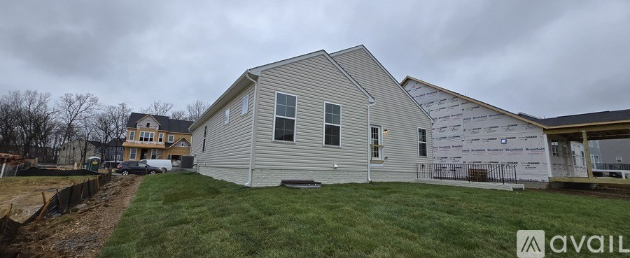 A house under construction with a sign that says "available".