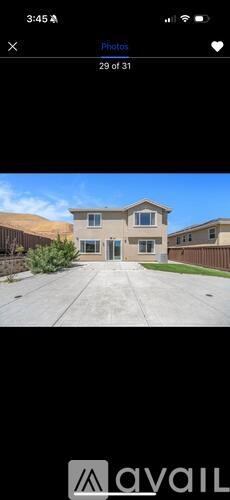 A house with a driveway in front of it.