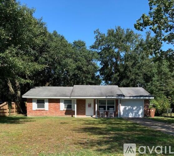 A house with a garage is for sale.