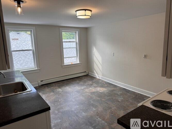 A kitchen with granite countertops and a sink.