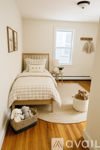 A bedroom with a bed, a chair, a window, and a wall hanging.