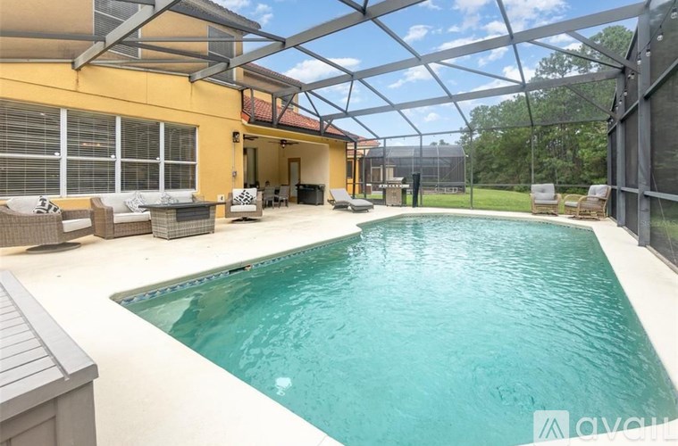 A pool in a backyard with a glass ceiling.