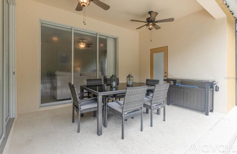 A patio with a table and chairs is shown.