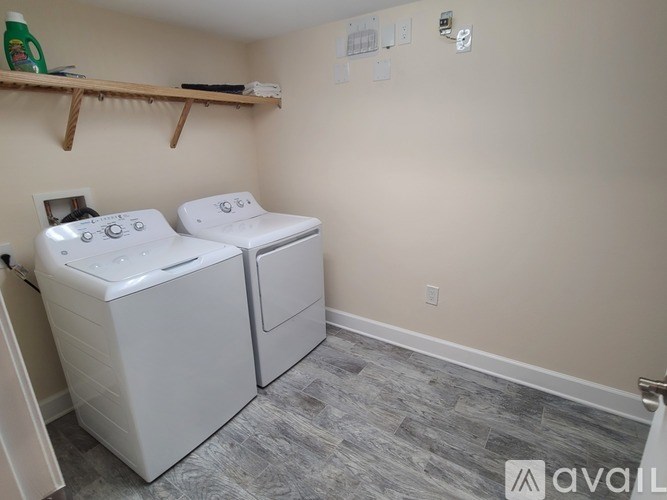 A laundry room with a washer and dryer.