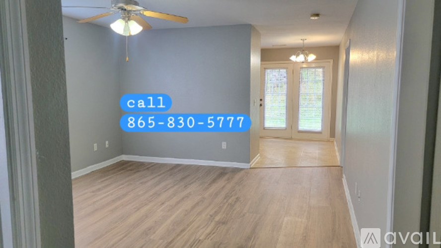 A room with a call sign and a phone number on the wall.