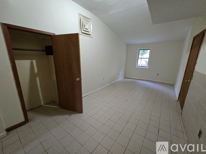 A room with a door and a window.