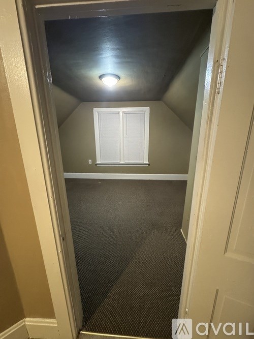 A small room with a door and a window.
