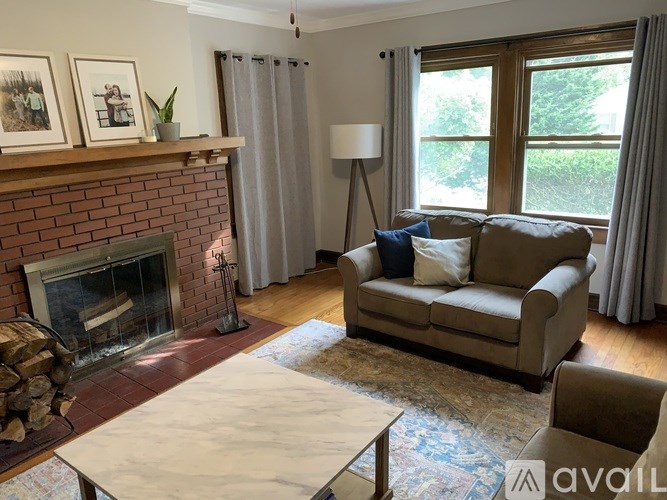 A living room with a fireplace and a couch.