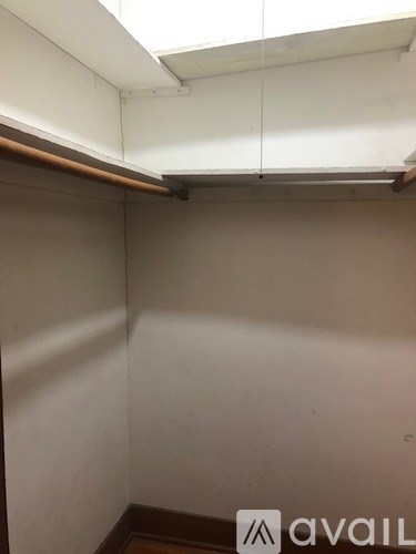 A small, empty room with a skylight.