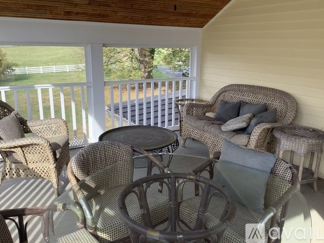 A patio with a table and chairs.