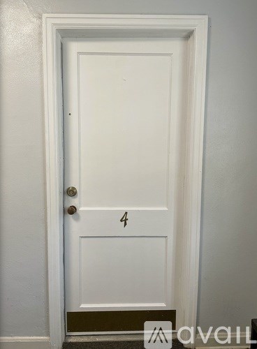 A white door with a number 4 on it.
