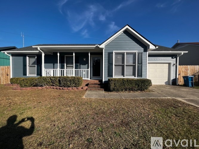 A house with a blue sky in the background.