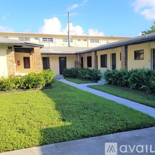 A building with a lawn in front of it.