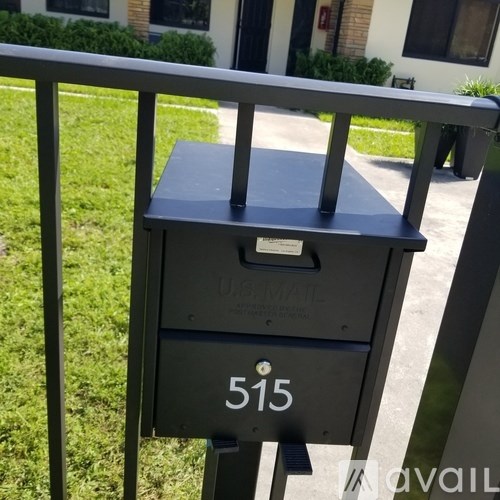 A black mailbox with the number 515 on it.