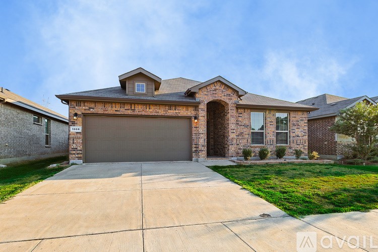 A house with a garage is for sale.