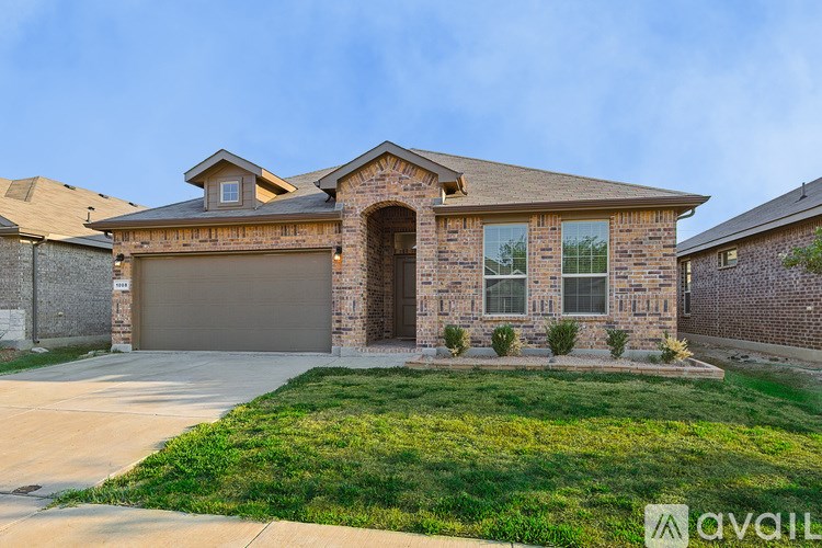 A house with a brown door and windows is for sale.