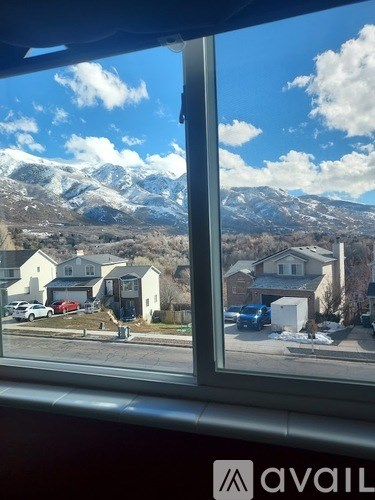 A view of a mountain range from a window.