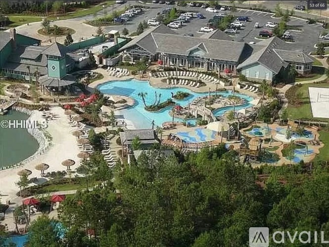 A large resort with a pool and a water slide.