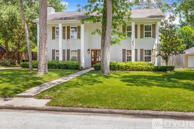 A white house with a flag on the front.
