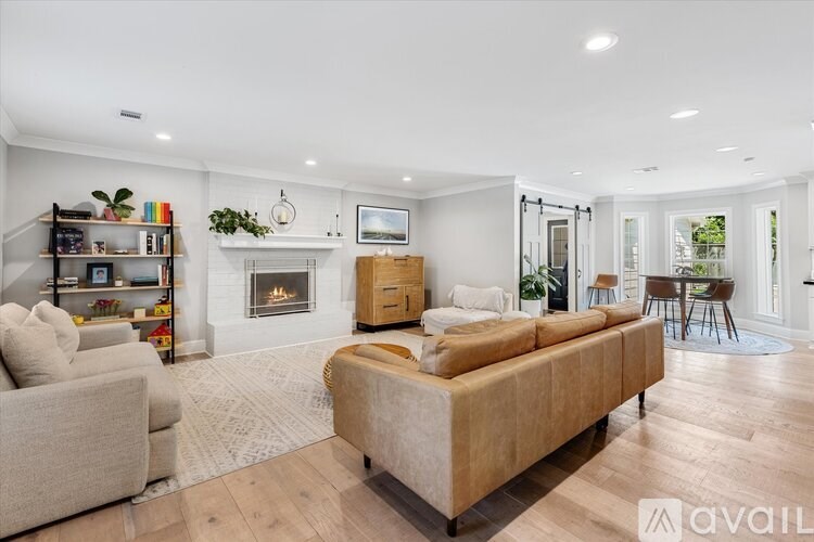 A living room with a fireplace and a couch.