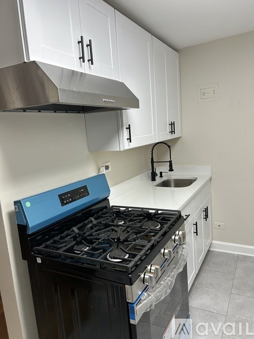 A kitchen with a blue stove top oven.