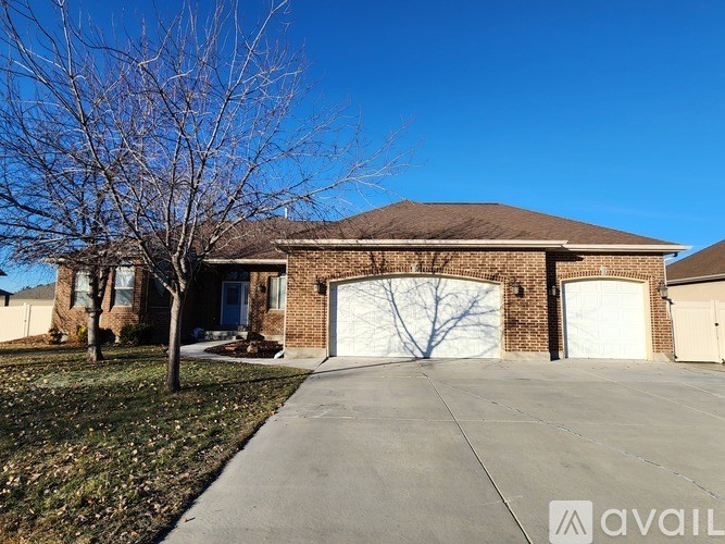 A house with a brown roof and a white garage door.
