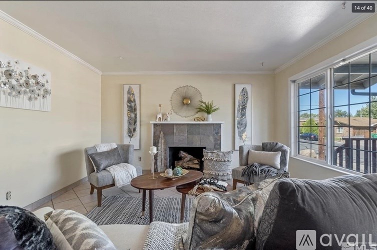 A living room with a fireplace and a couch.