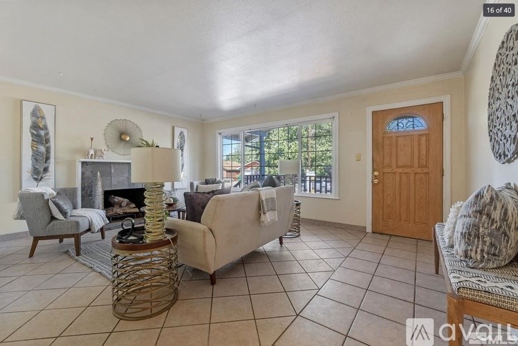 A living room with a fireplace and a couch.