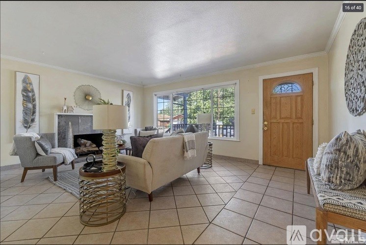 A living room with a fireplace and a couch.