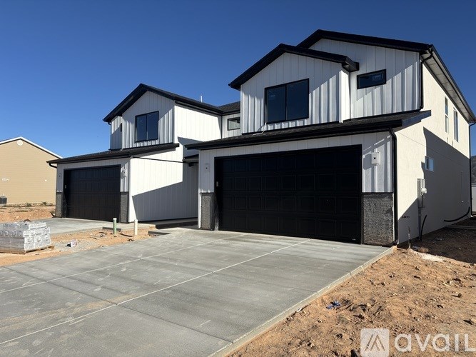 A modern two-story house with a garage.