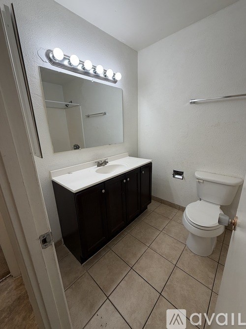 A white door with a black metal gate and handle.