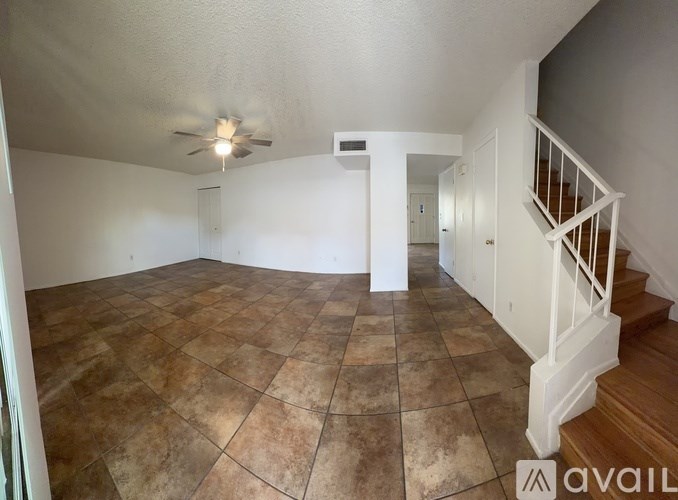 A white door with a glass window and a black handle.