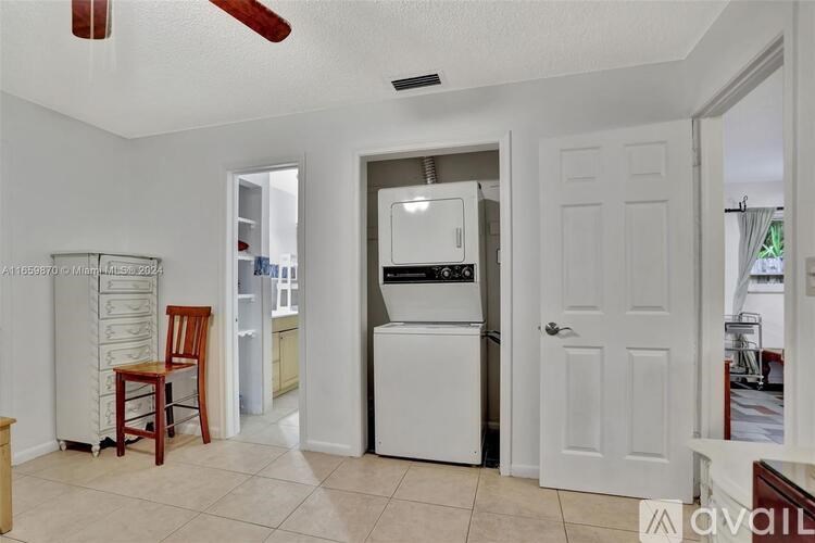 A kitchen with a white fridge and a white oven.