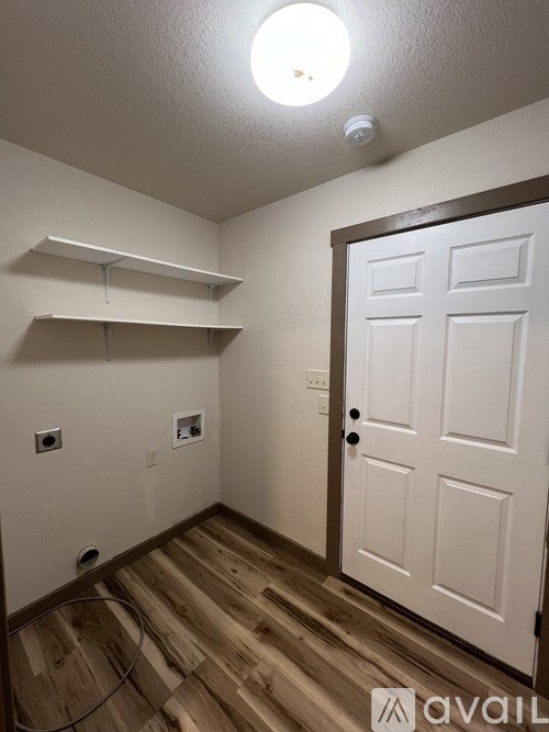 A white door is on the right side of the image.
