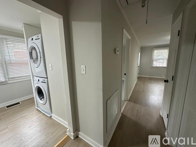 A laundry room with a washer and dryer in it.